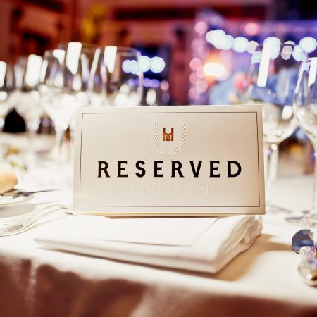 Reserved sign on a table in restaurant